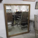 A large gilt framed bevel edged wall mirror, 130cm