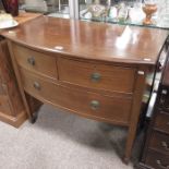 An Edwardian mahogany bow front chest of two drawe
