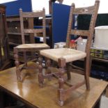 A set of six oak rush seated dining chairs, carved