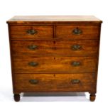 A George III mahogany chest of two short over three long cockbeaded drawers