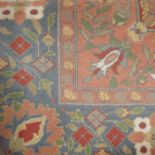 Persian style rug, blue border decorated with flow