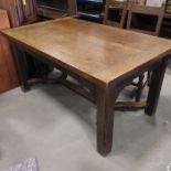 An oak plank top dining table, block supports and