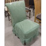 An Edwardian upholstered bedroom chair, on square