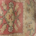 Persian styyle rug, salmon pink ground and geometr