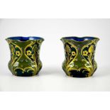 William Moorcroft for James MacIntyre, a mateched pair of Green and Gold Florian Ware vases