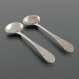 A pair of George III English Provincial silver salt spoons