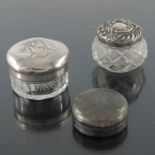 Three silver topped glass jars