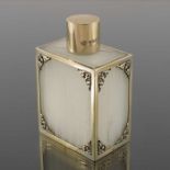 An Elizabeth II silver gilt and plastic toilet bottle, Asprey and Co., London 1954, the fluted cuboi