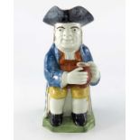 A Staffordshire Prattware pottery toby jug, circa 1840