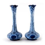 William Moorcroft for James MacIntyre, a matched pair of Florian Blue Peacock vases