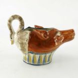 A Staffordshire pottery sauce boat in the form of a fox head and swan
