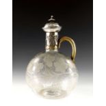 A Victorian silver mounted etched glass claret jug