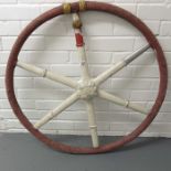 A cast iron ships wheel with canvas grip, 85cm dia