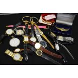 A large collection of watches, including Rotary, T