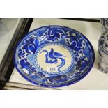 A Continental faience blue and white dish painted