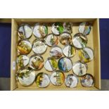 Twenty three Victorian souvenir glass paperweights