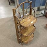 A Victorian cane three tier shelf, trellis and ben