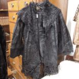 A Victorian black satin and applique jacket, a fau