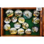 Twenty six Victorian souvenir glass paperweights,