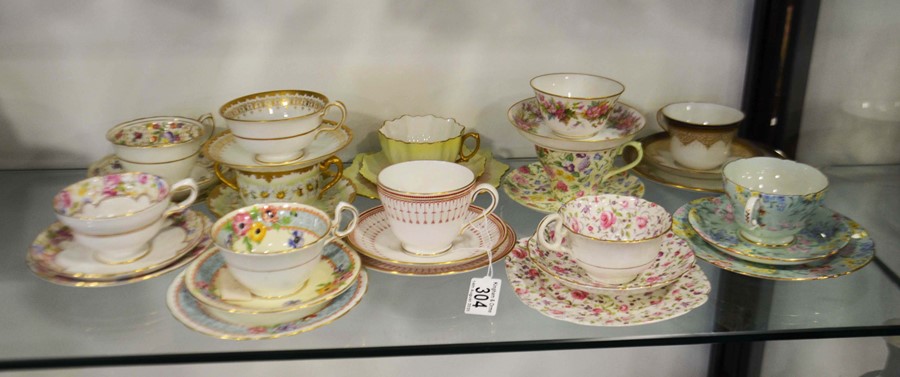 A large collection of tea trios and cabinet cups a