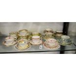 A large collection of tea trios and cabinet cups a