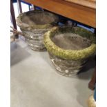 A pair of cast stone jardinieres/ garden planters