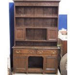 A George III oak dresser and rack, two drawers abo