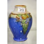 A Royal Doulton stoneware vase, tubelined fruit.