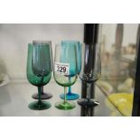 A harlequin set of coloured drinking glasses. (5