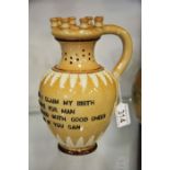 A Doulton Lambeth stoneware puzzle jug with applie