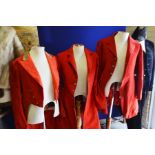 Four assorted red hunting coats.