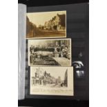 A collection of postcards in album, topographical