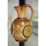 A Doulton Lambeth stoneware jug, ovoid form with t