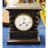An oak framed mantel clock, white enamelled dial a