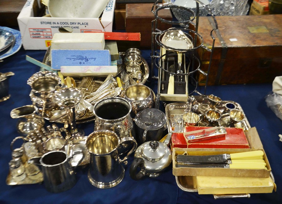 A collection of silver including flatware, tankard