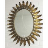 Oval wall mirror, gilt metal acanthus and ropetwis