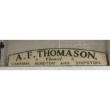 A large painted advertising sign, A F Thomason, Ch