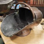 A copper coal scuttle