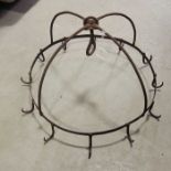 A wrought iron crown game hook