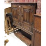 A carved oak cabinet, linen fold carved decoration