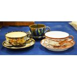 Three Japanese cups and saucers including Satsuma,