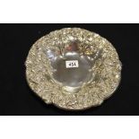 An Art Nouveau embossed silver plated dish, decora