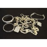 A collection of silver including chains and bangle