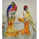 Two Wade bird figures, Woodpecker on tree stump, a