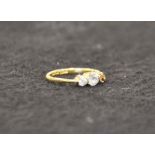 An 18 carat gold and diamond ring