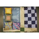 A patchwork quilt, lace bobbins and four sample st