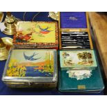 A collection of vintage tins together with various