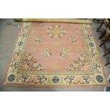 A large Persian style, pink ground with flower and