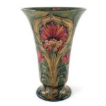 William Moorcroft for James MacIntyre, a Cornflower vase, 1911, footed trumpet form, underglaze