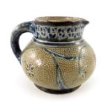 Robert Wallace Martin for Martin Brothers, a stoneware jug, circa 1890, squat ovoid form,